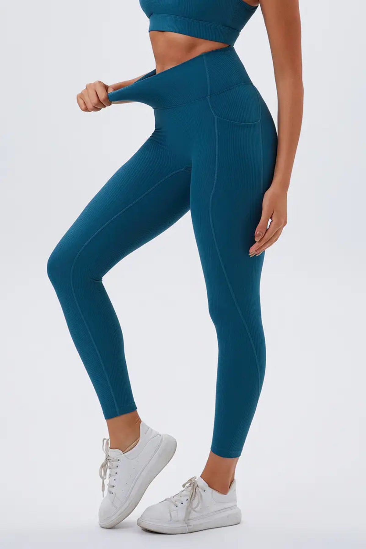 Eco-friendly High-Waisted Leggings with Side Pockets Navy Blue close-up on the left
