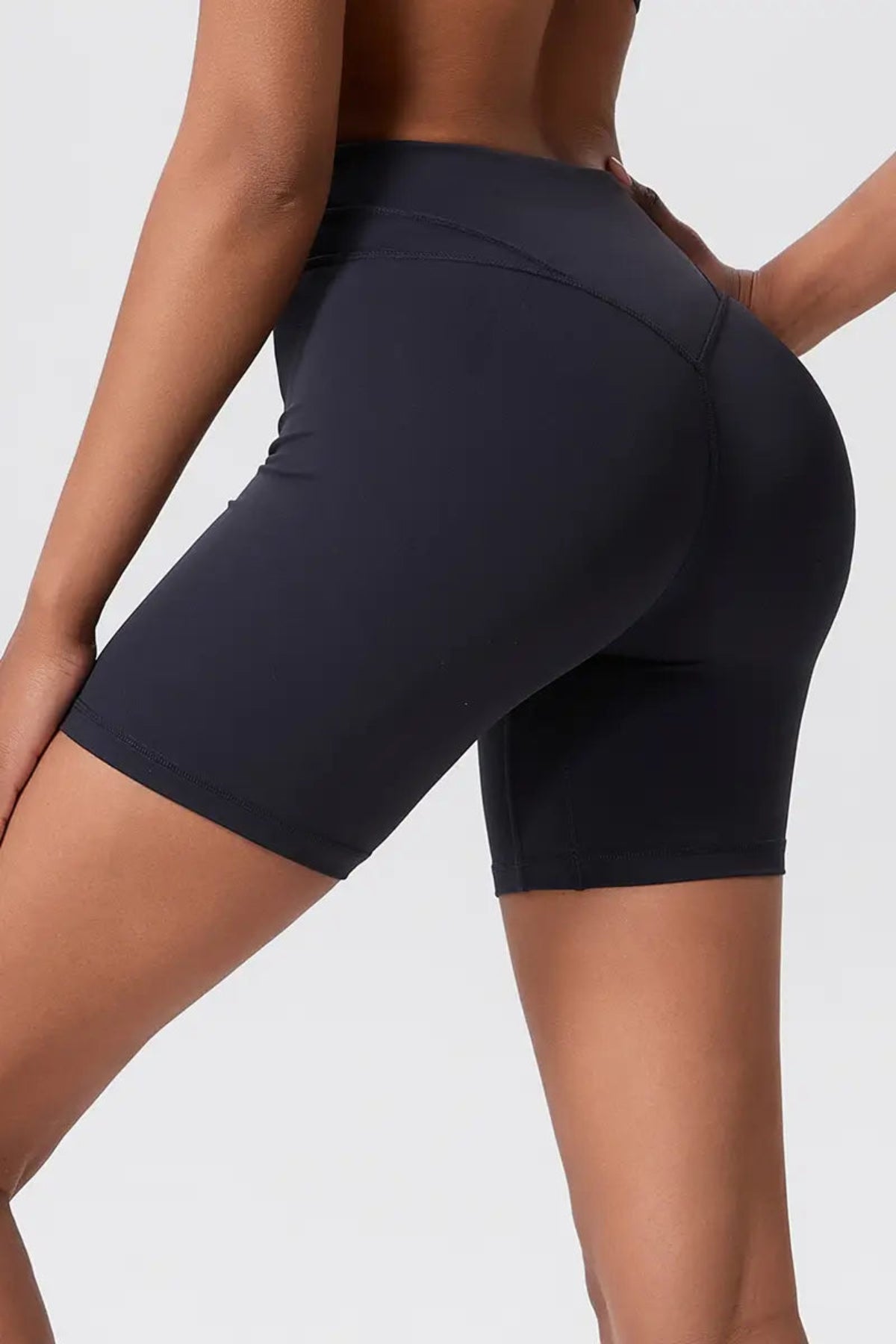 Women’s High-Waisted Pocket Sports Shorts Pants Black Close up of buttocks