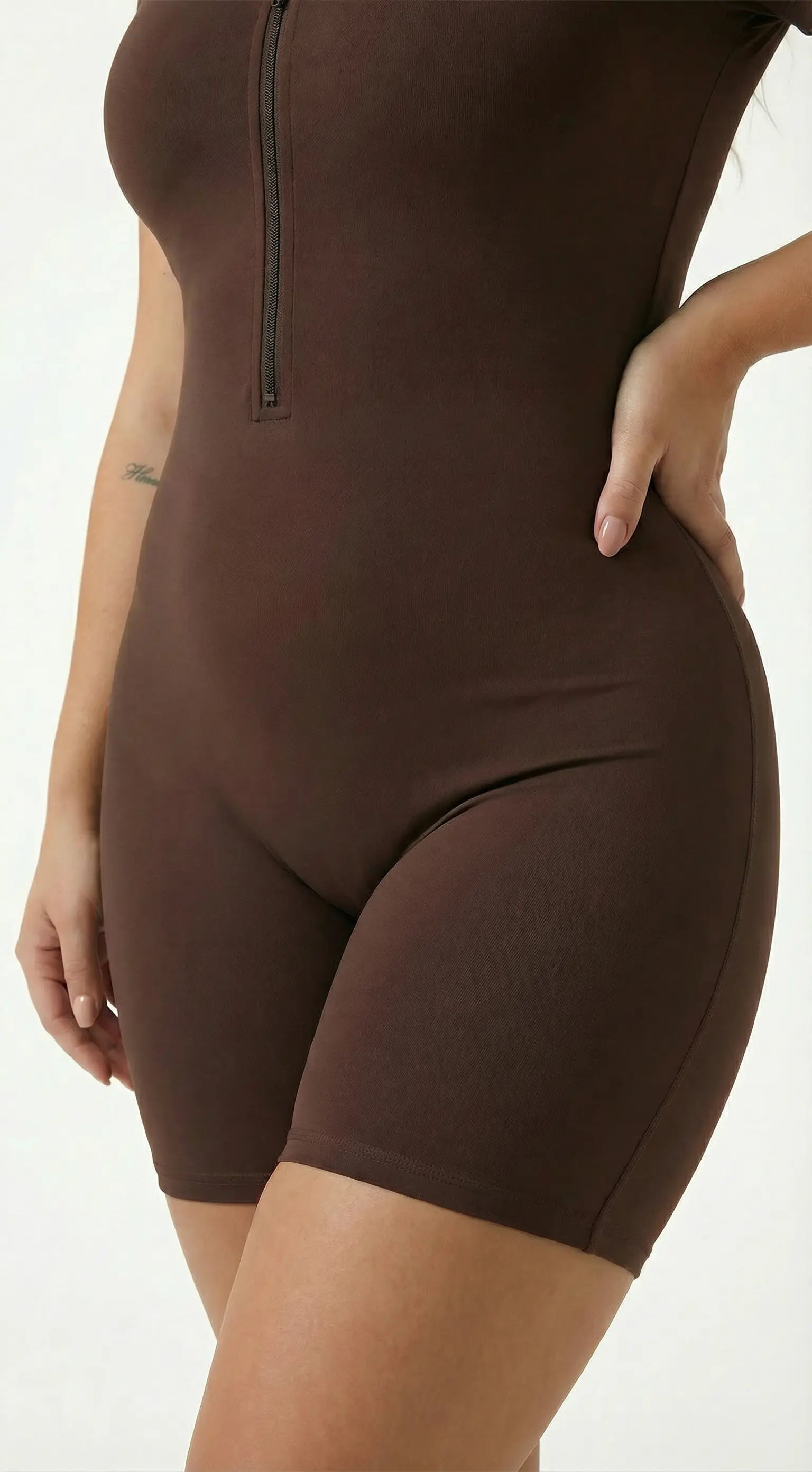 Women's Half-Zip Workout Jumpsuit Brown Waist close-up and Pants leg close-up