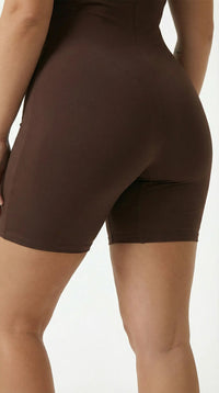 Women's Half-Zip Workout Jumpsuit Brown Hips close-up