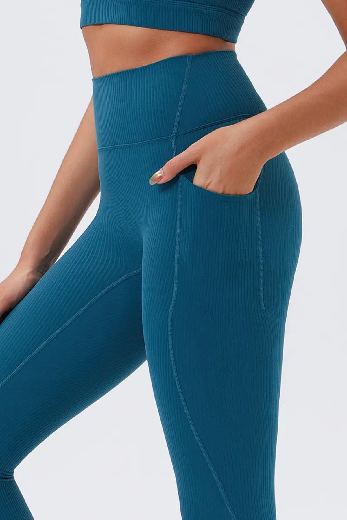 Eco-friendly High-Waisted Leggings with Side Pockets Navy Blue close-up on the left